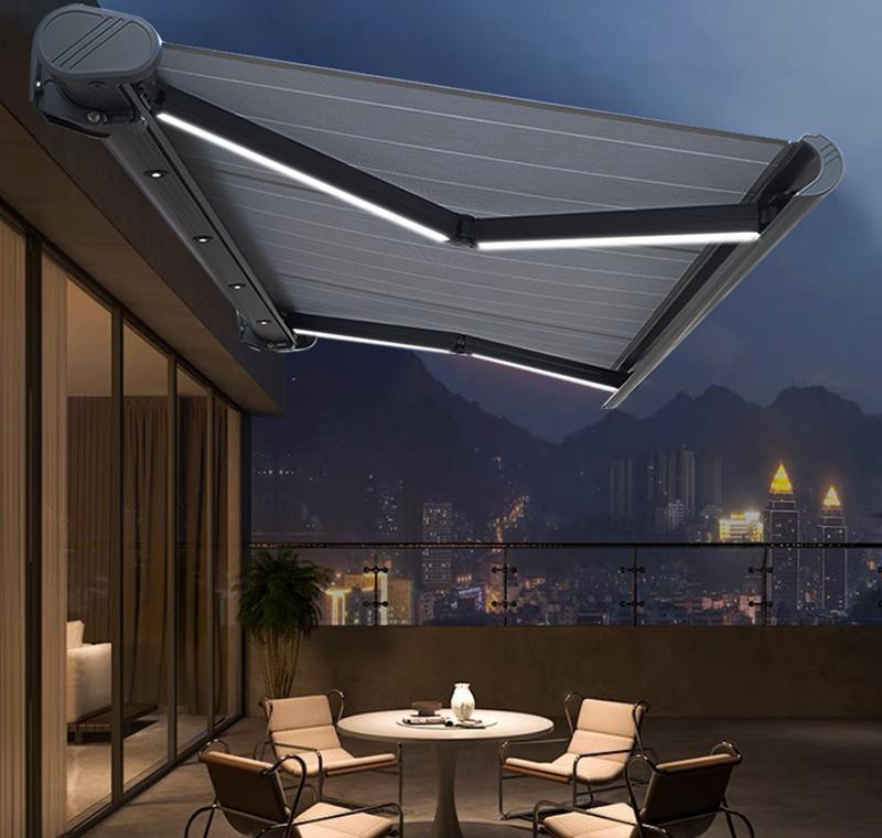 Full cassette awning with optional arm lighting in an evening setting